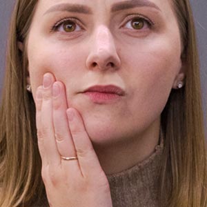 Woman dealing with facial pain