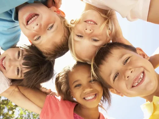 Group of children smiling down at the camera